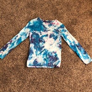A size 10/12 tie-dye shirt with long sleeves